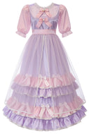 A pink and purple tiered Lolita-style dress with short puff sleeves, a lace-trimmed neckline, and multiple ruffled layers with bows, shown on a plain white background.
