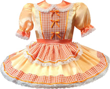 An adult sissy dress with a peach satin skirt, orange and white gingham panels, lace trim, and orange ribbon bows on the bodice.